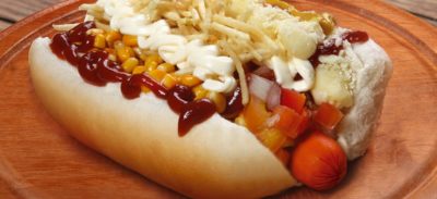 Hot Dog Vendor Serving A Customer